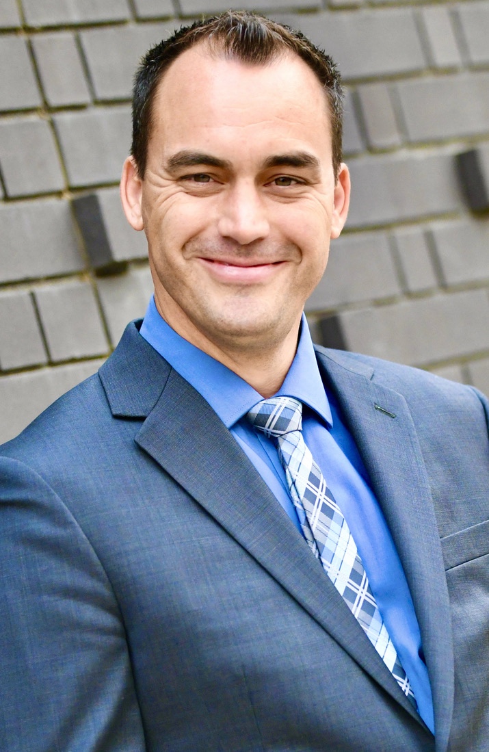 Kris Bentz in a blue suit